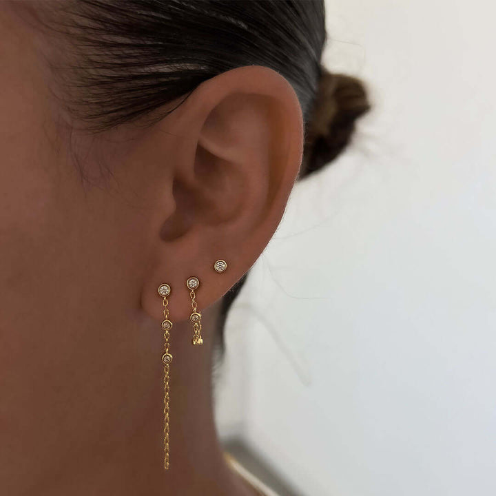 Libi Earrings worn by a model showcasing their sleek and dainty design with a minimalist style.