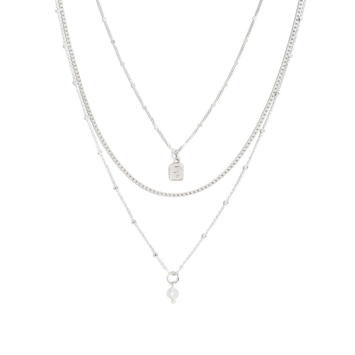 Nice Necklace featuring triple-layer chains for effortless layering and maximum style.