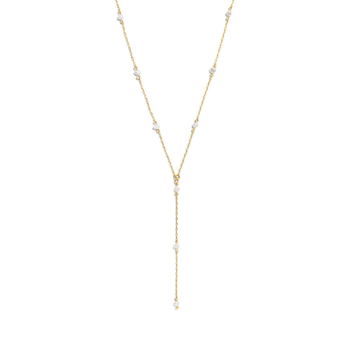 Tulum Necklace featuring a pearl lariat design, ideal for a beach getaway look and perfect for layering.