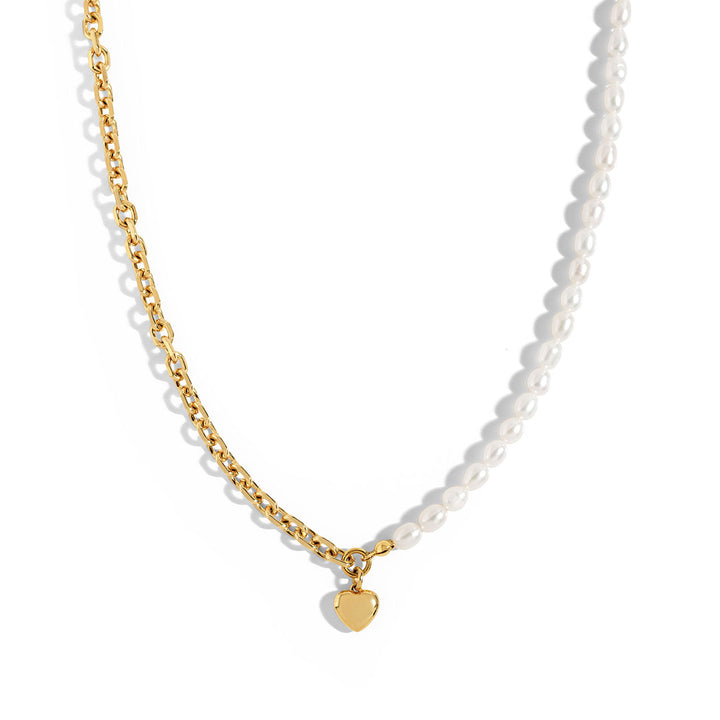 Nina Necklace featuring a gold link chain and natural pearls with a heart charm, stylish and elegant accessory.