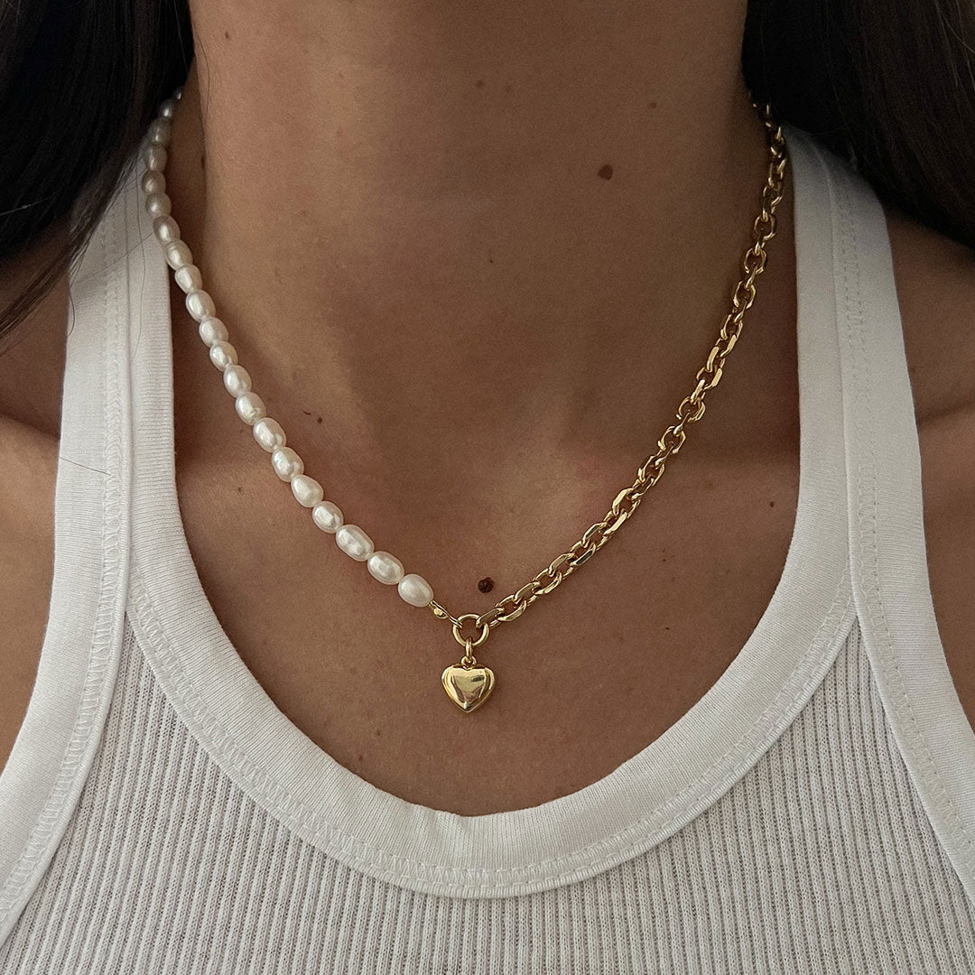 Nina Necklace featuring a structured link chain and natural pearls, perfect for edgy and elegant styling.