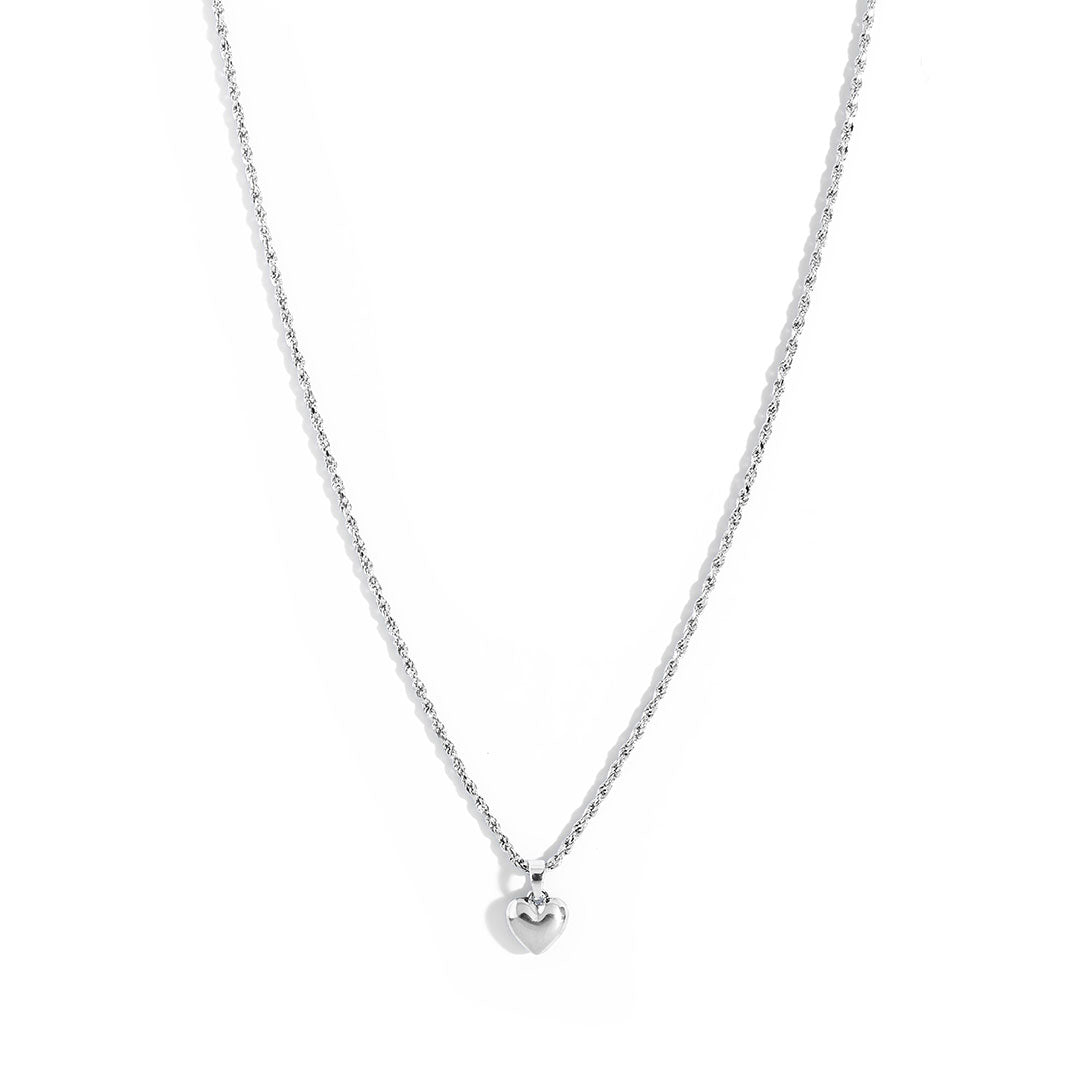 Mali Heart Necklace featuring a delicate braided chain and a small heart pendant, perfect for everyday wear.