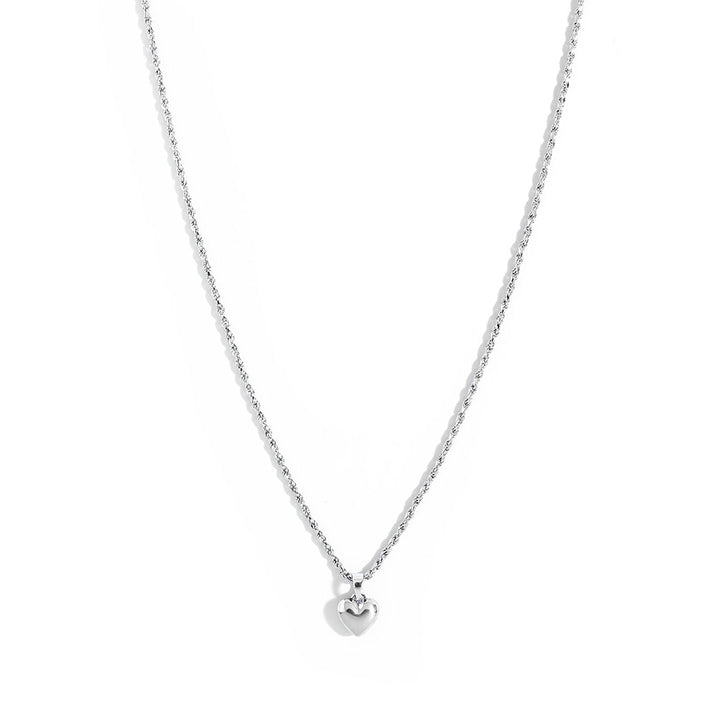 Mali Heart Necklace featuring a delicate braided chain and a small heart pendant, perfect for everyday wear.