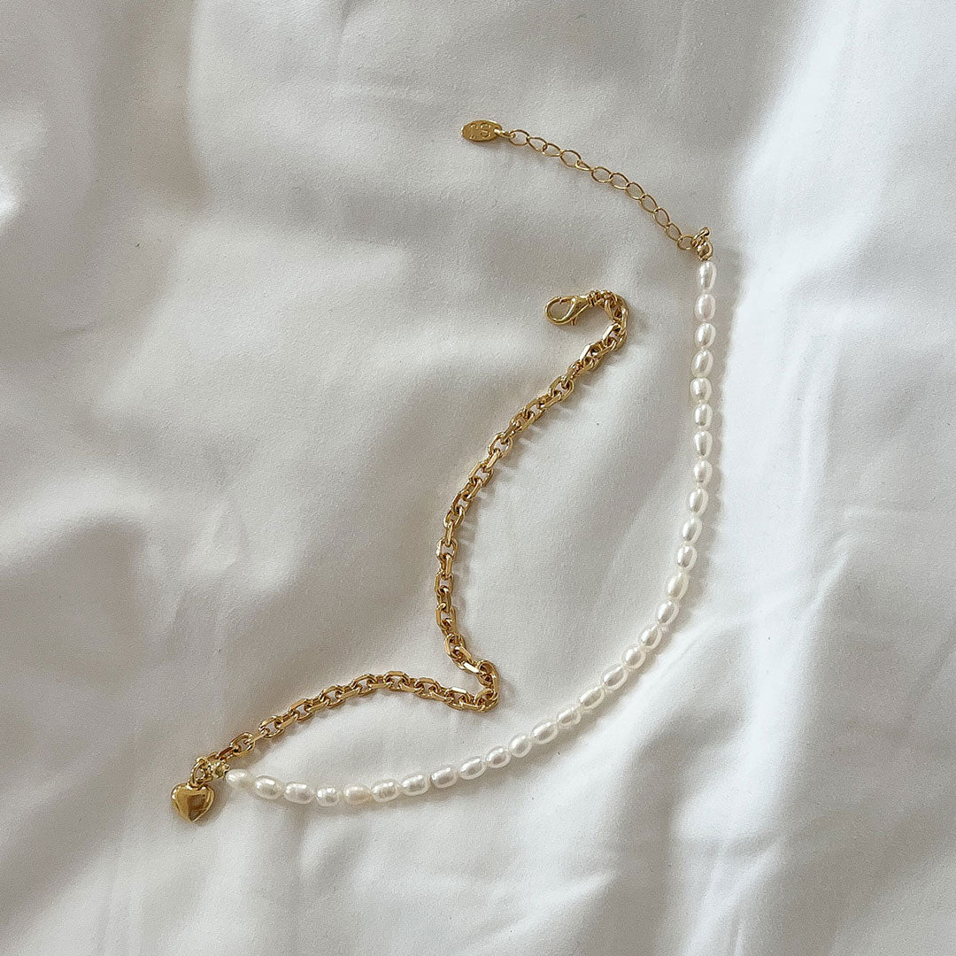 Nina Necklace featuring a structured link chain and natural pearls, perfect for edgy and elegant styles.
