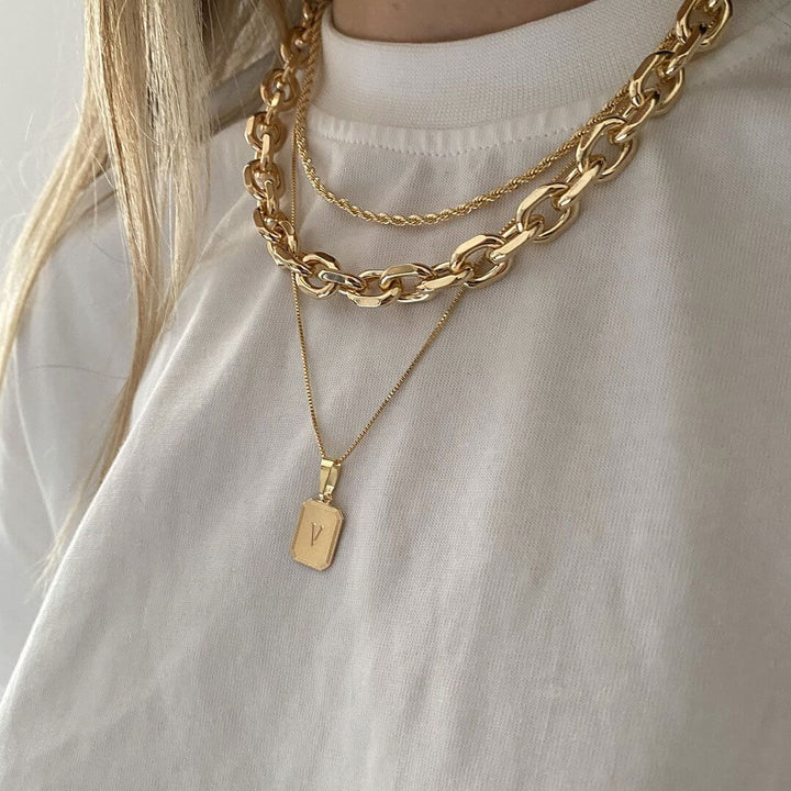 Dylan Necklace Set featuring layered gold necklaces including Mali, Dylan, and Vintage Initial Necklace.