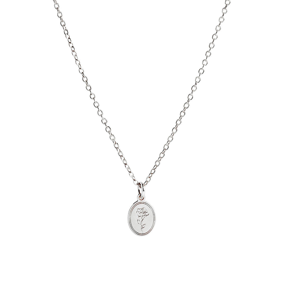 Eva Necklace featuring a delicate link-chain design and an oval pendant with a soft rose detail.