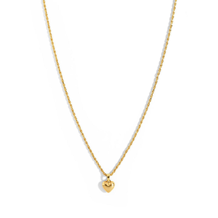 Mali Heart Necklace featuring a delicate braided chain with a small heart pendant, perfect for everyday wear.
