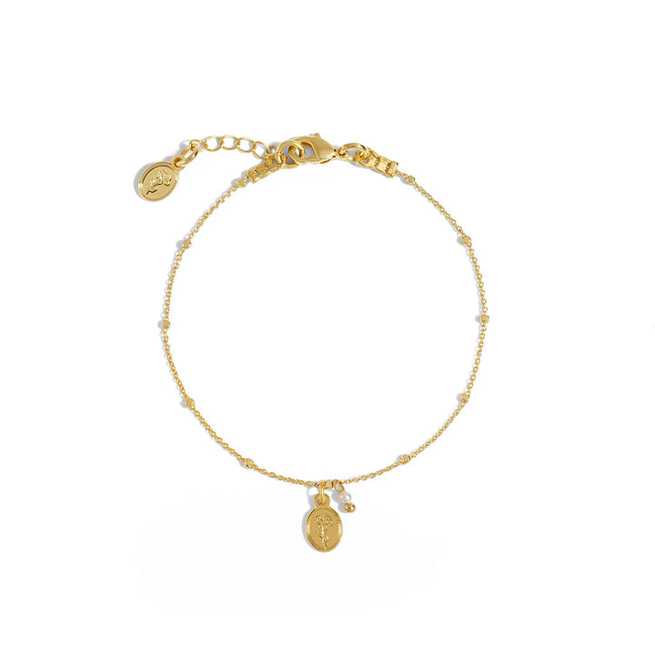 Flory Bracelet featuring a delicate chain, oval rose charm, and natural pearl, perfect for stacking or wearing alone.