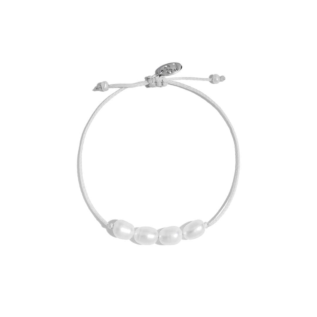 Ariel Bracelet featuring freshwater pearls on a handmade cord, adjustable for a perfect fit.