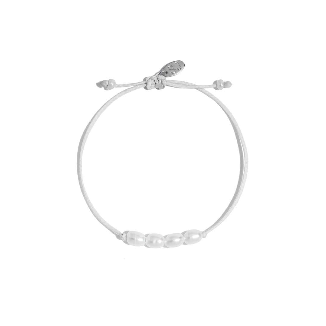 Ariel Bracelet featuring a handmade cord design with freshwater pearls on a neutral tone cord.
