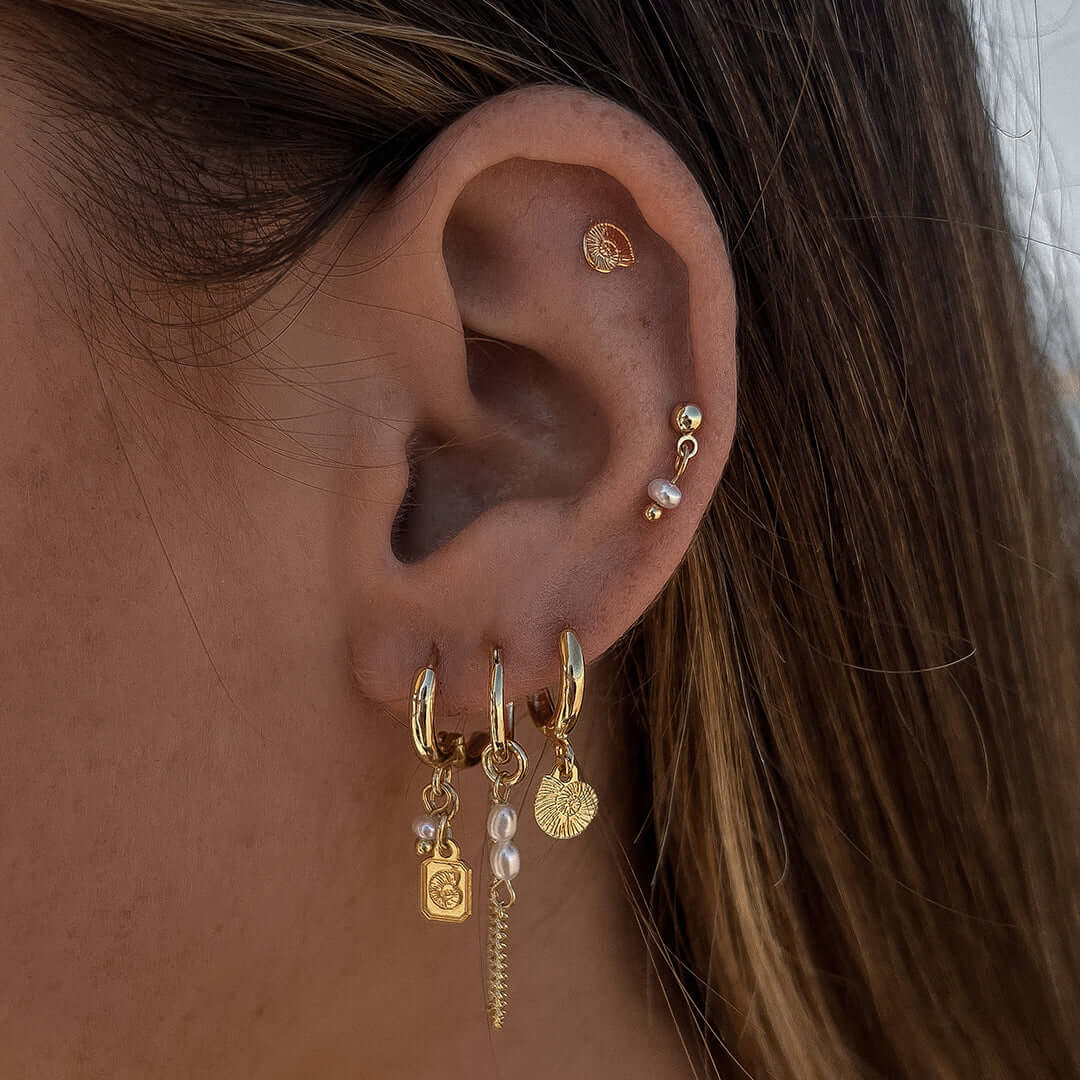 Reef Earrings Set featuring gold hoops, pearls, and charm details showcasing ocean vibes.