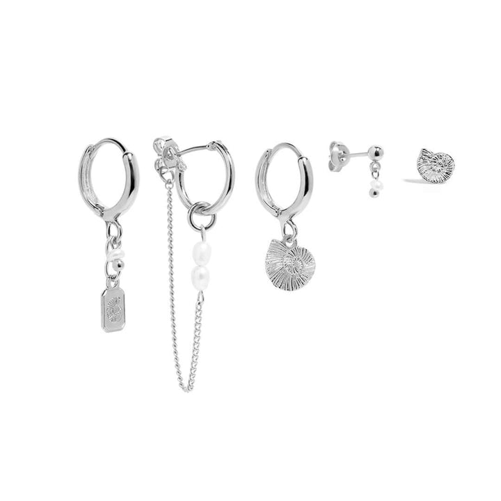 Reef Earrings Set featuring hoops, shells, and natural pearls for an ocean-inspired look.