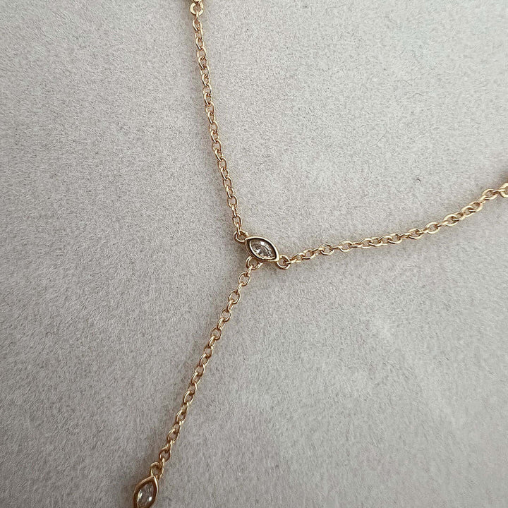 Sol Hand Chain Bracelet featuring a fine chain and sparkling crystal stone for elegant jewelry styling.