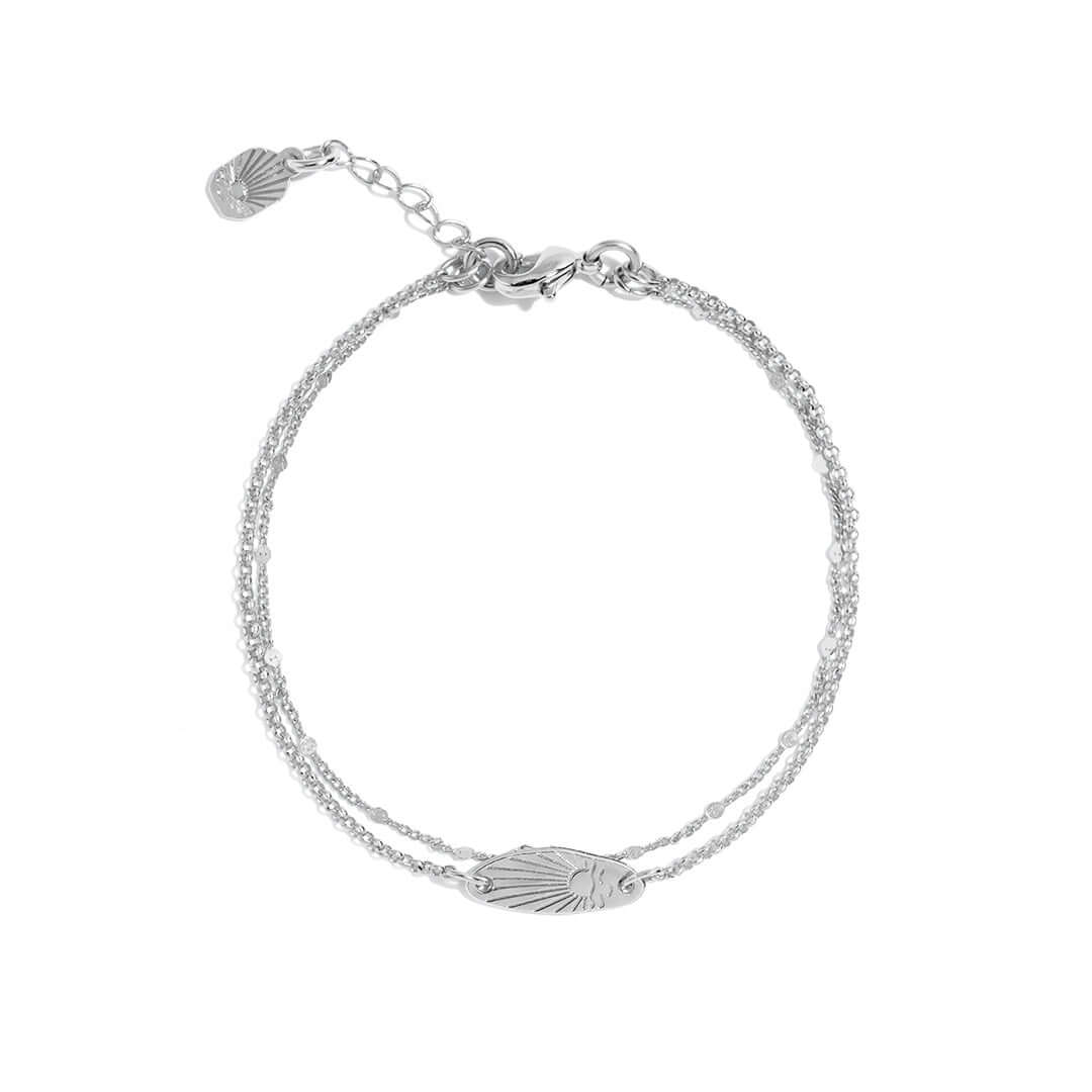 A delicate Sunset Bracelet featuring a unique surfboard shape engraved with a sunset design, perfect for everyday wear.