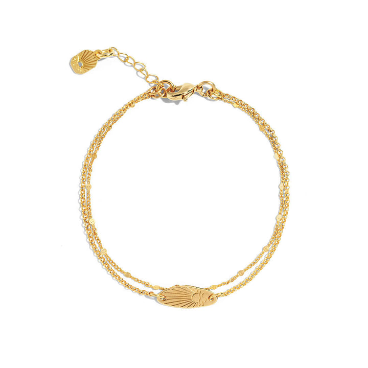 Sunset Bracelet featuring a delicate surfboard shape with engraved sunset design, perfect for everyday wear.