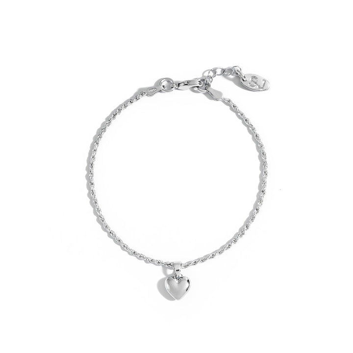 Mali Heart Bracelet with a delicate braided chain and heart charm, ideal for feminine styles.