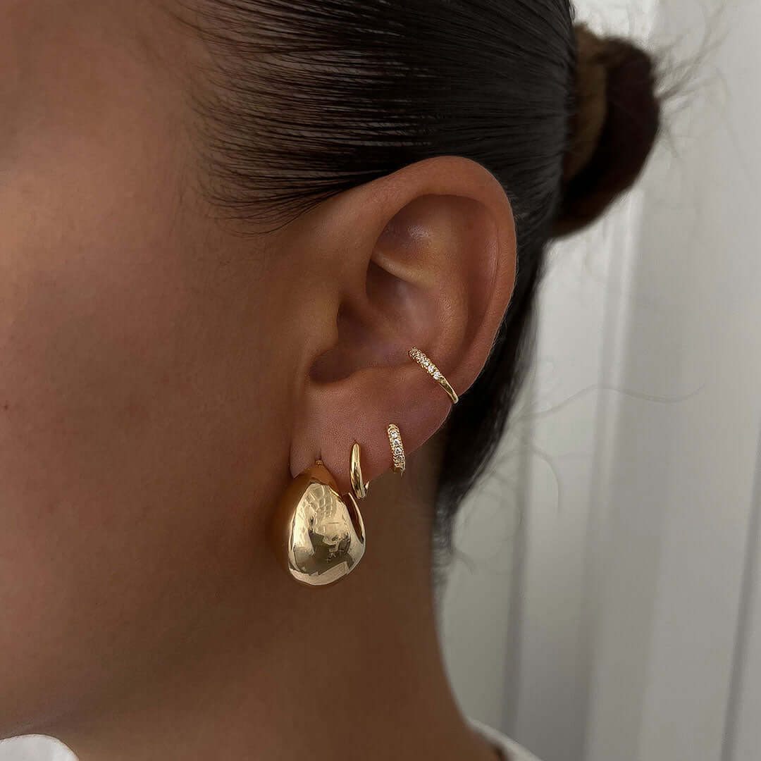 Luna Earrings showcasing a bold gold design, lightweight on ears, perfect for everyday wear and style.