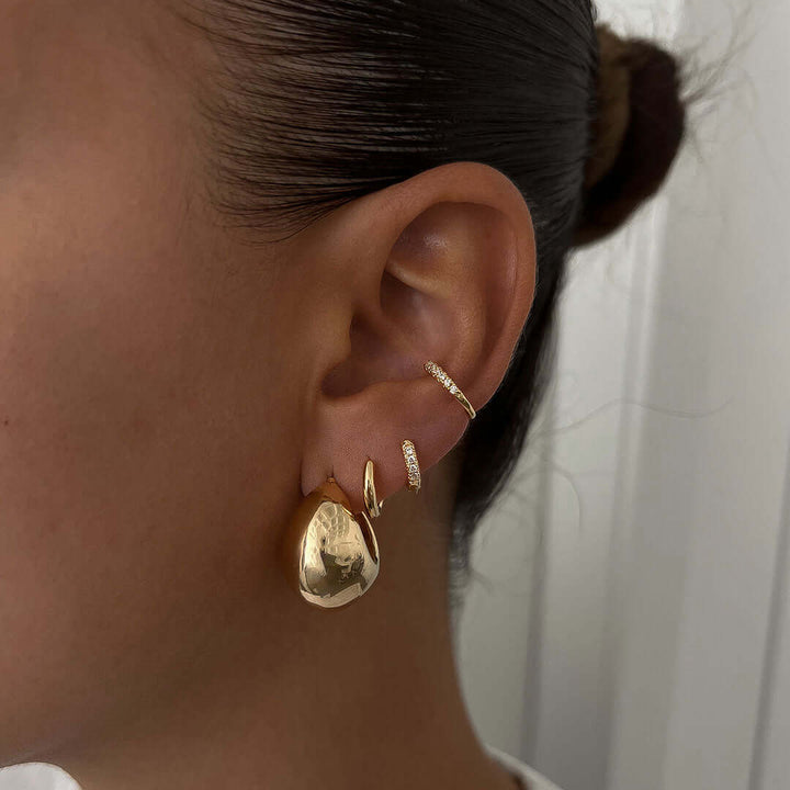 Luna Earrings showcasing a bold gold design, lightweight on ears, perfect for everyday wear and style.