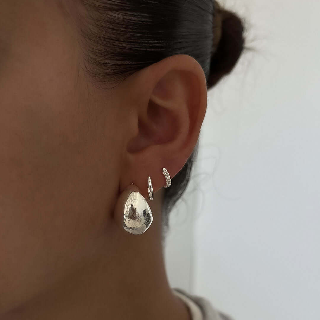 Luna Earrings showcased on an ear, featuring a bold chunky design and lightweight comfort for everyday wear.