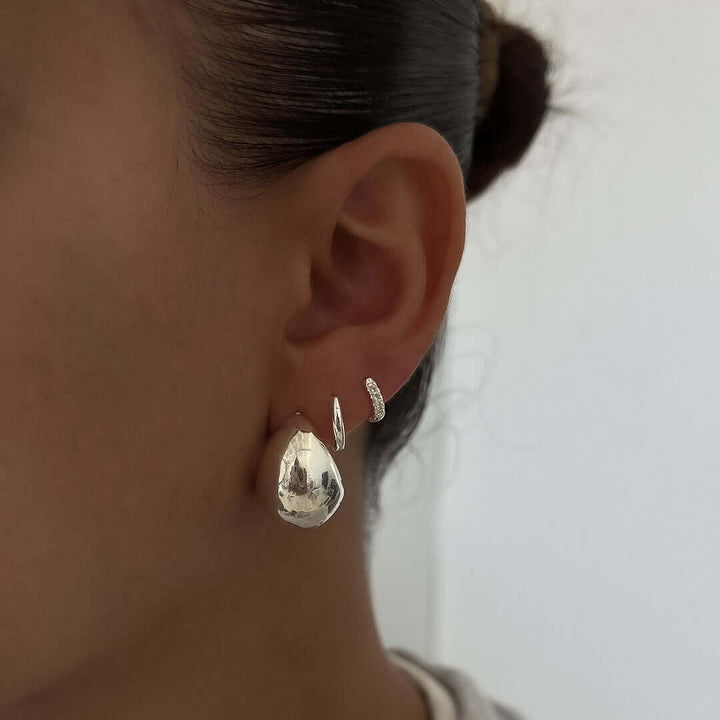 Luna Earrings showcased on an ear, featuring a bold chunky design and lightweight comfort for everyday wear.