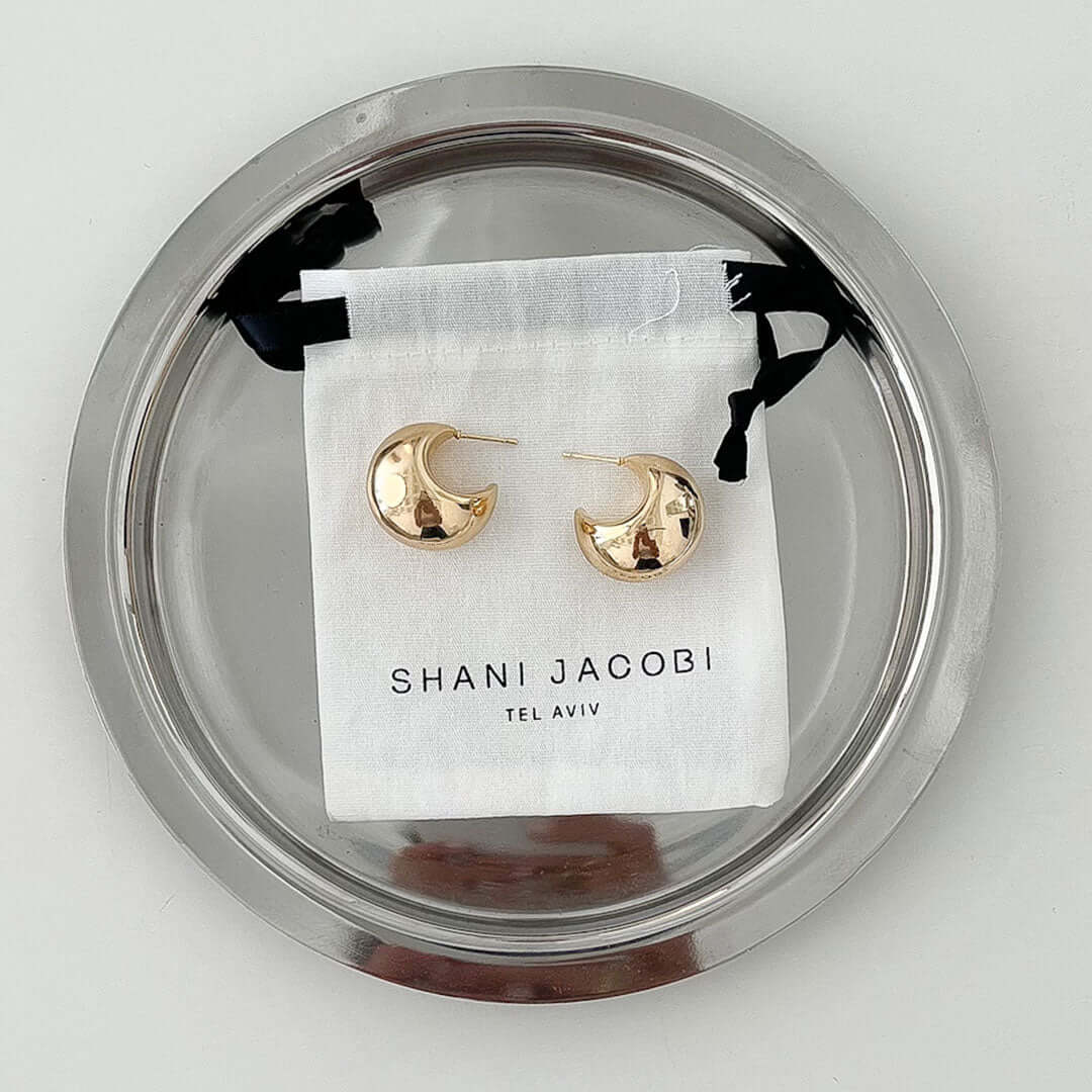 Luna Earrings displayed on a plate, featuring a bold and comfy design, perfect for any outfit.