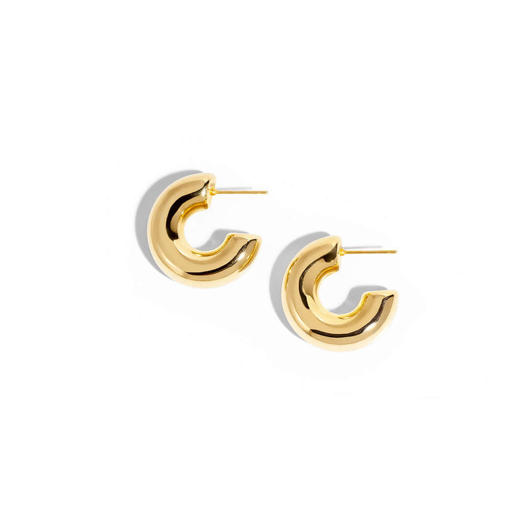 Stylish Mango Earrings in a glossy gold finish, perfect for adding a touch of elegance to any outfit.