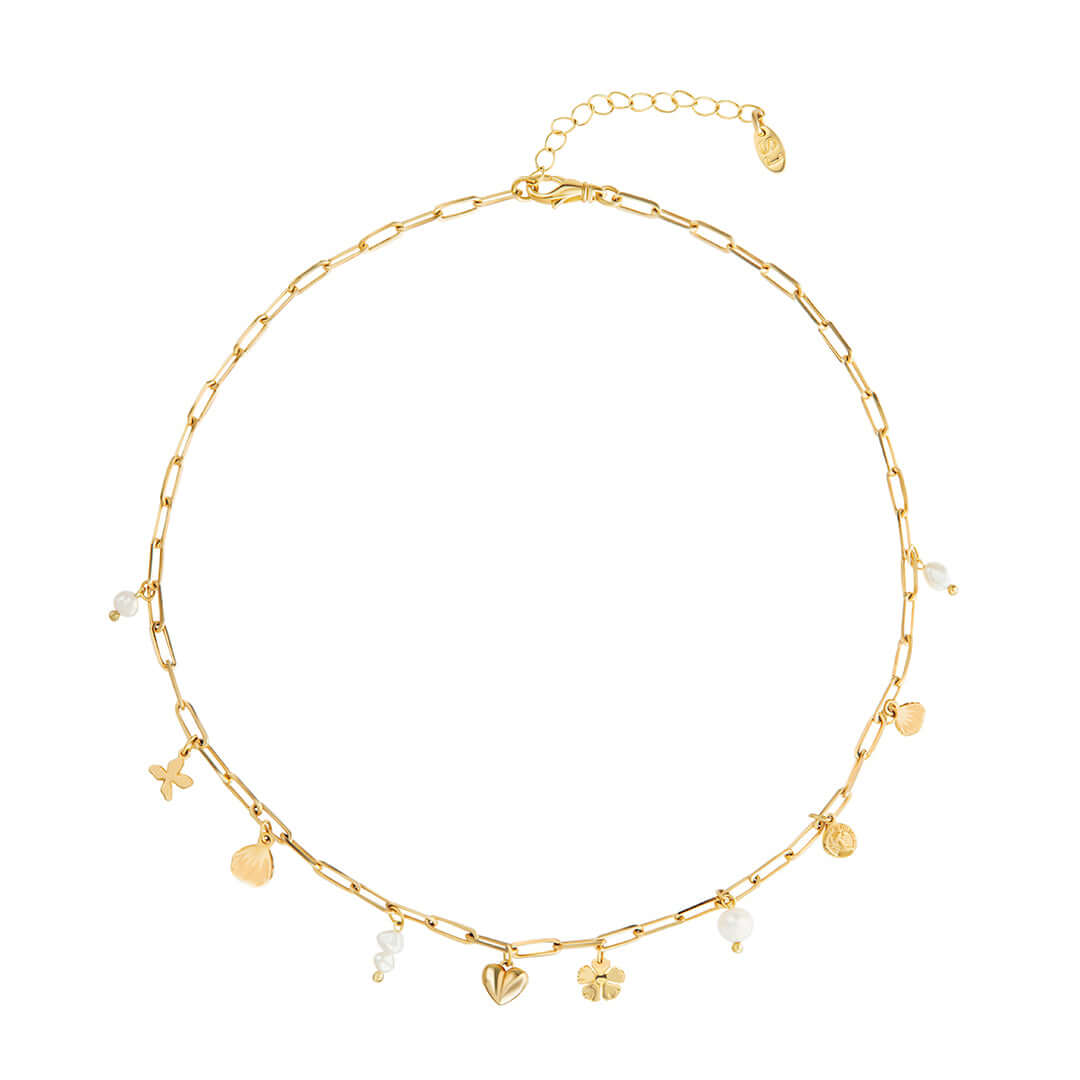 Gold Story Necklace by Shani Jacobi with pearls and charms including a heart and clover, perfect for layering.