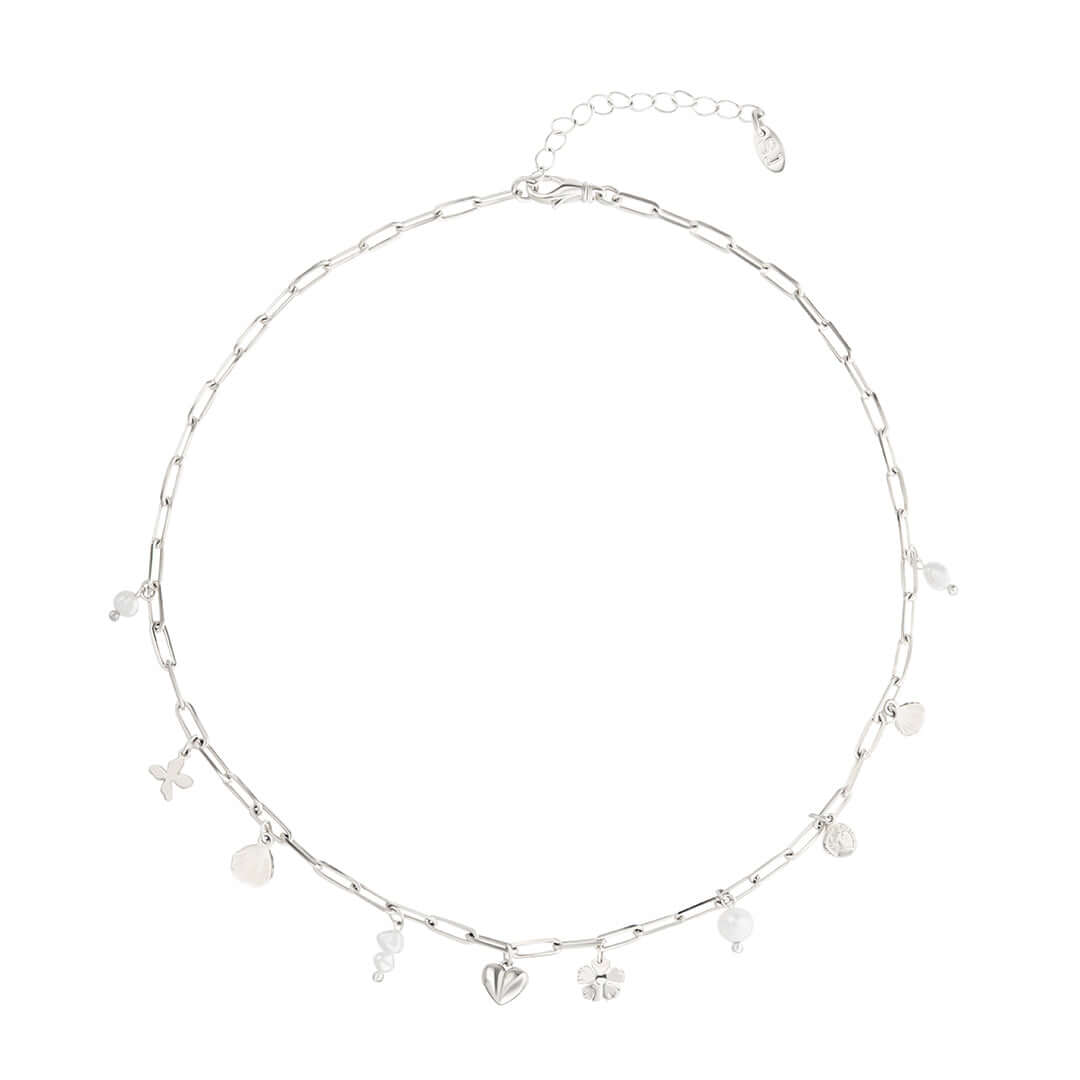 Shani Jacobi Story Necklace featuring a silver chain with dainty pearls and playful charms, perfect for everyday wear.
