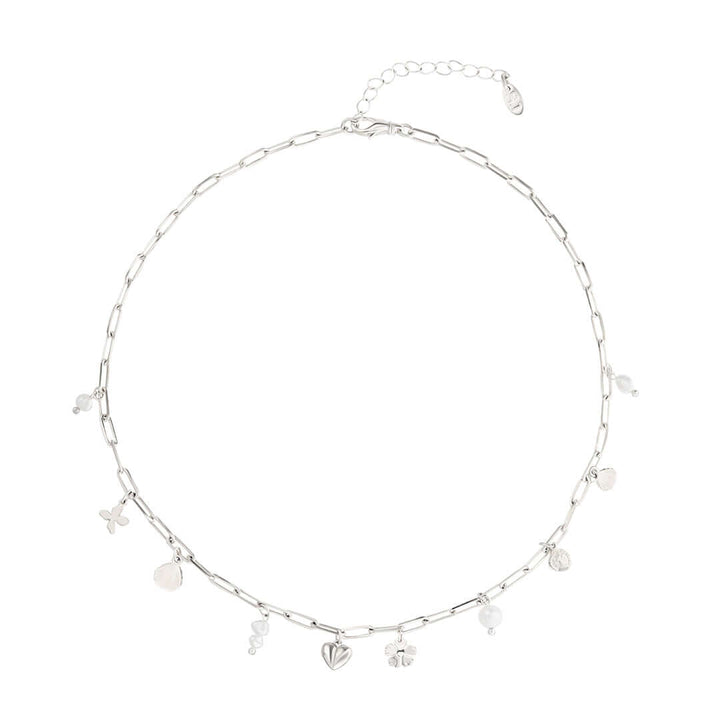Shani Jacobi Story Necklace featuring a silver chain with dainty pearls and playful charms, perfect for everyday wear.