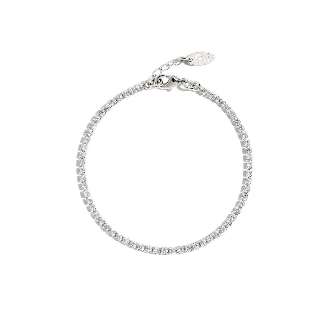 Elegant Shani Jacobi tennis bracelet in silver plated brass with crystal stones, hypoallergenic, 17cm length.