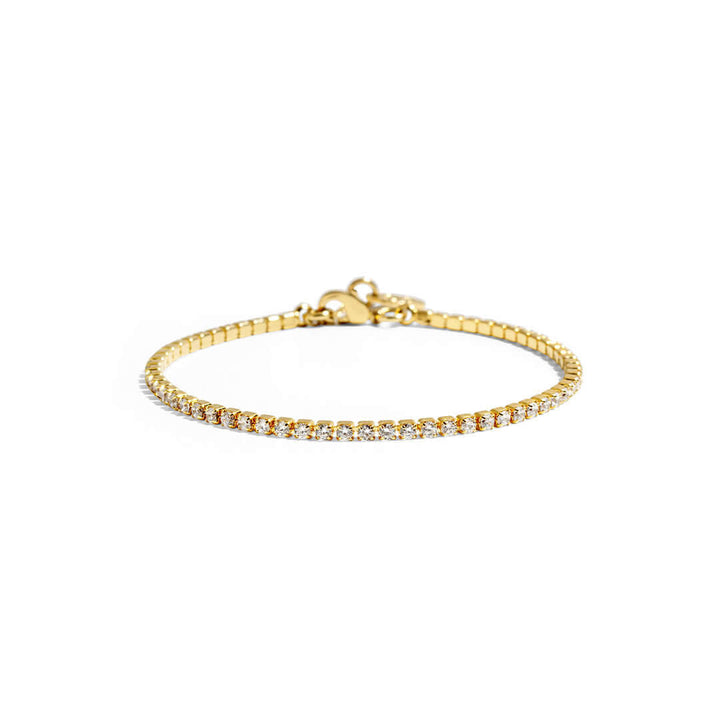 Tennis bracelet by Shani Jacobi, 14K gold plated with crystal stones, hypoallergenic, 17cm length, stylish and elegant.
