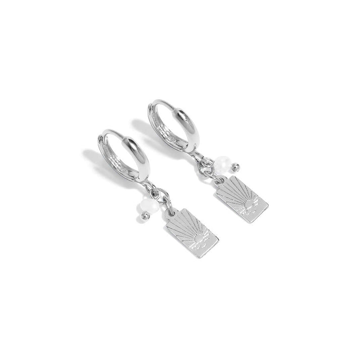 Sunny Earrings featuring a dainty drop design and sunset-inspired charm for everyday elegance.