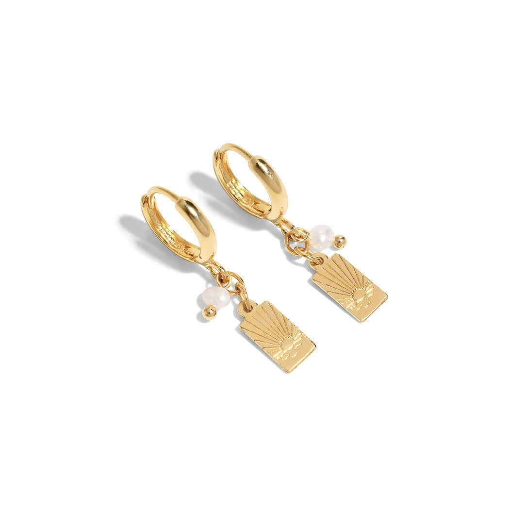Sunny Earrings featuring a dainty drop design with sunset-inspired charm and pearl accents.