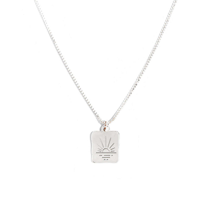 Sunset Necklace featuring a delicate charm inspired by a setting sun, perfect for everyday wear.
